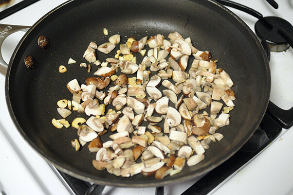 3Cook garlic and mushrooms