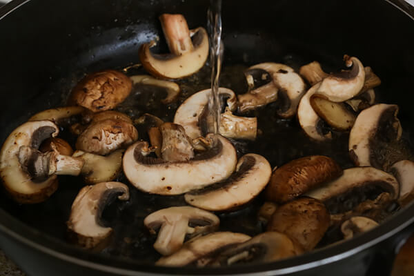 Mushrooms cooking in the pan.