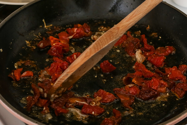 Cooking sun-dried tomatoes.