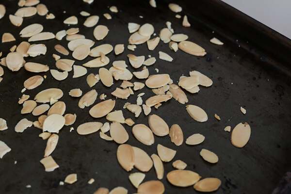 Toasted almonds on a baking sheet.