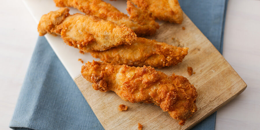 Close up shot showing texture of the fried chicken strips.